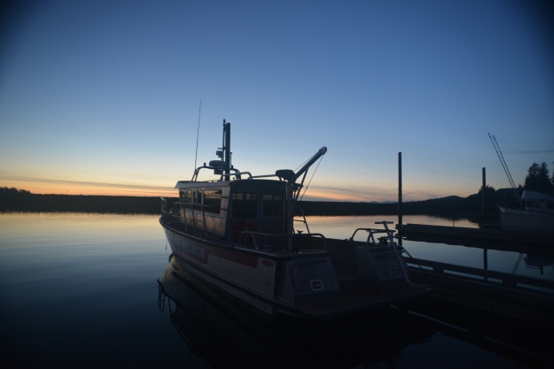 photo of a boat docked at sunet